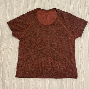This is a size 6 Lululemon Swiftly Tech short sleeve 2.0, in the color rust.